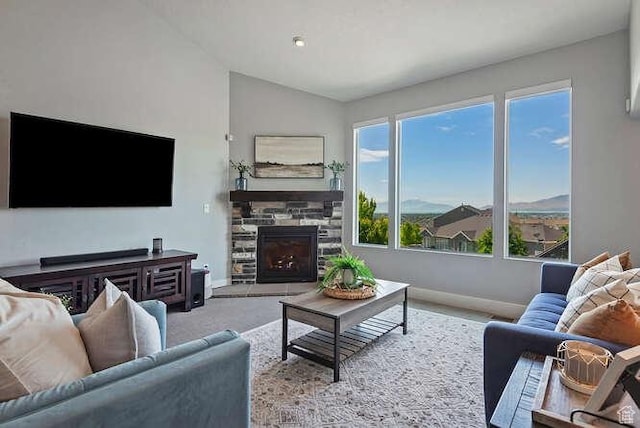735 W Horizon Dr, Lehi, UT 84043 - living room featuring a stone fireplace, lofted ceiling, and carpet flooring
