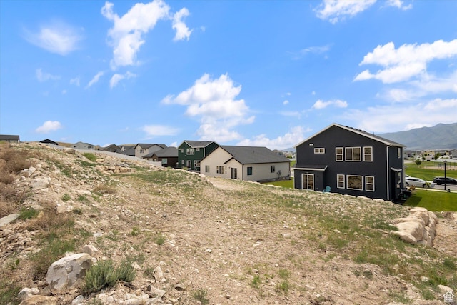 7982 N Bristlecone Rd, Eagle Mountain, UT 84005 - rear view of property featuring a residential view and a mountain view