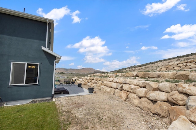 7982 N Bristlecone Rd, Eagle Mountain, UT 84005 - view of yard featuring a deck with mountain view