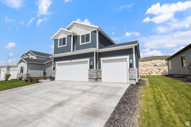 7982 N Bristlecone Rd, Eagle Mountain, UT 84005 - view of front of property with stone siding, a front lawn, driveway, and a garage