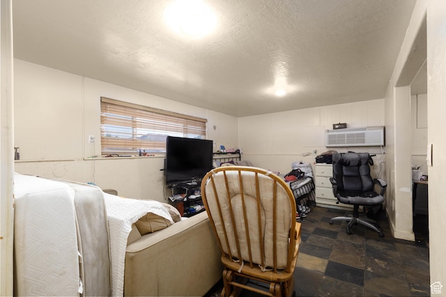 577 W 400 S, Hurricane, UT 84737 - office space with a wall mounted AC, a textured ceiling, and dark stone finish floors