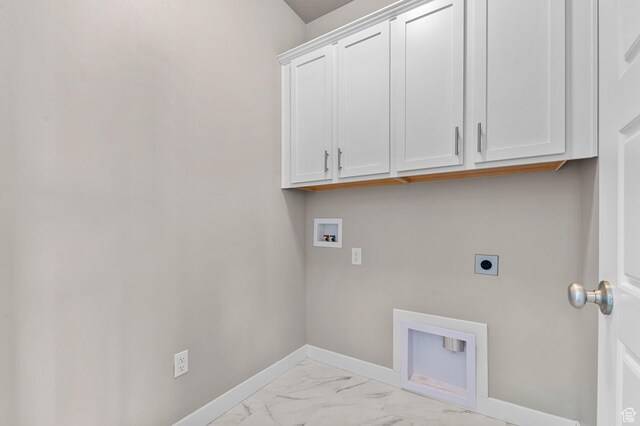 1298 E Salt Creek Peak, Eagle Mountain, UT 84005 - laundry area featuring cabinet space, hookup for an electric dryer, washer hookup, and light marble finish floors