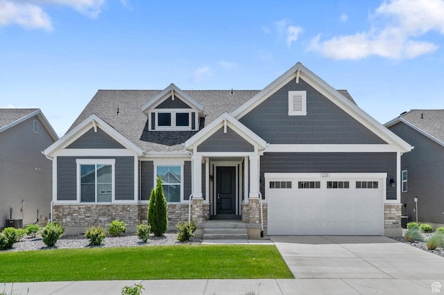 1298 E Salt Creek Peak, Eagle Mountain, UT 84005 - craftsman-style home with stone siding, a garage, driveway, and a shingled roof