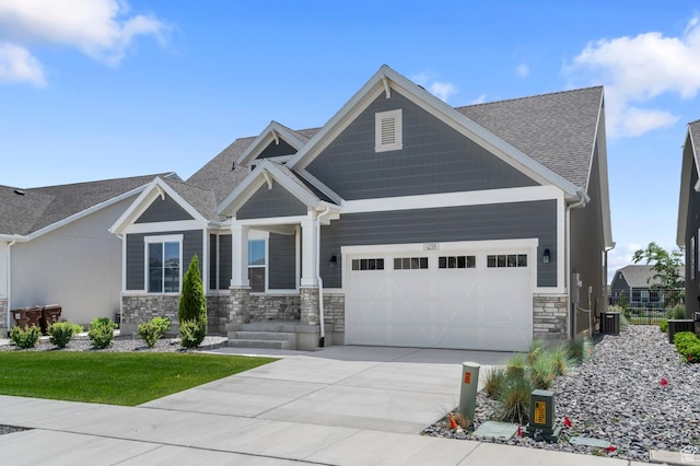 1298 E Salt Creek Peak, Eagle Mountain, UT 84005 - craftsman-style house with an attached garage, stone siding, driveway, and a shingled roof