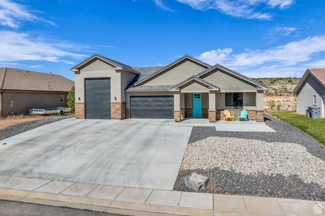 992 S Mulberry Dr, Toquerville, UT 84774 - view of front of home featuring stone siding, an attached garage, concrete driveway, and stucco siding