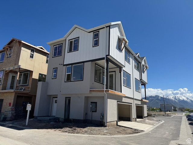 895 W Hobble Creek Ct S Unit 90, Springville, UT 84663 - view of property featuring an attached garage, a mountain view, and concrete driveway