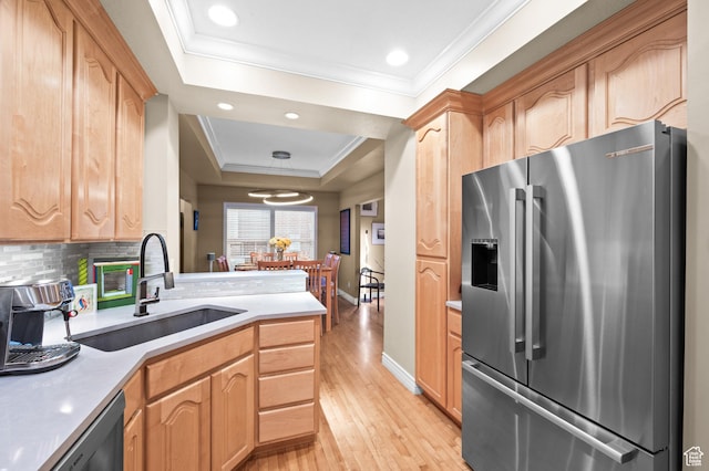 369 E 9th Ave, Salt Lake City, UT 84103 - kitchen with stainless steel refrigerator with ice dispenser, a tray ceiling, light wood-style flooring, ornamental molding, and light countertops
