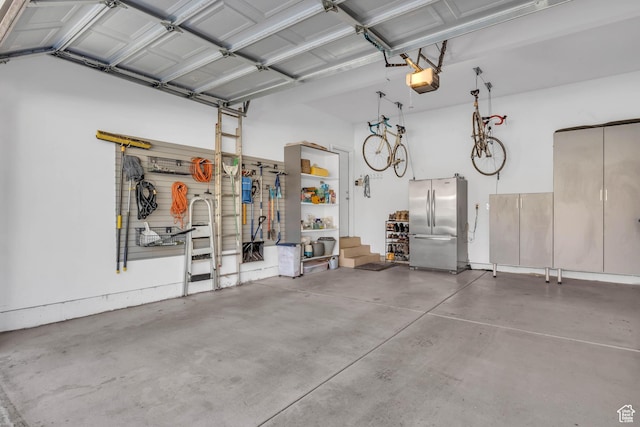 369 E 9th Ave, Salt Lake City, UT 84103 - garage with freestanding refrigerator and a garage door opener