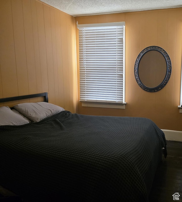 423 E 1st Ave N, Salt Lake City, UT 84103 - bedroom with wood finished floors and a decorative wall