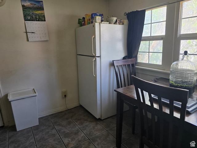423 E 1st Ave N, Salt Lake City, UT 84103 - kitchen with freestanding refrigerator and dark tile patterned flooring