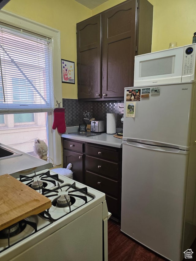 423 E 1st Ave N, Salt Lake City, UT 84103 - kitchen with white appliances, light countertops, dark brown cabinets, and dark wood finished floors