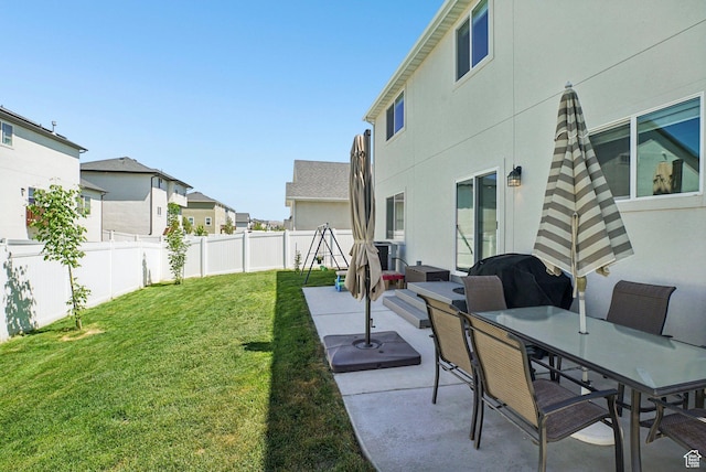 7215 N Clear Meadow Way, Eagle Mountain, UT 84005 - fenced backyard featuring a patio, a residential view, and outdoor dining area