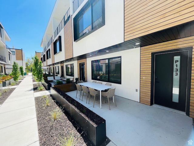 4186 S Main St Unit O217, Millcreek, UT 84107 - view of patio / terrace featuring outdoor dining area