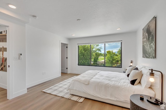 4186 S Main St Unit O217, Millcreek, UT 84107 - bedroom with wood finished floors and recessed lighting