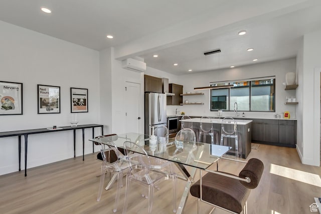 4186 S Main St Unit O217, Millcreek, UT 84107 - dining room featuring light wood-type flooring, a wall unit AC, and recessed lighting