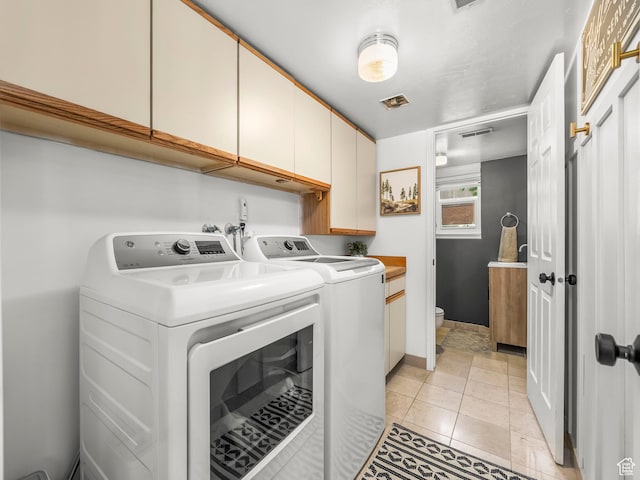 1705 E Plata Way, Sandy, UT 84093 - washroom with cabinet space, washer and dryer, and light tile patterned flooring