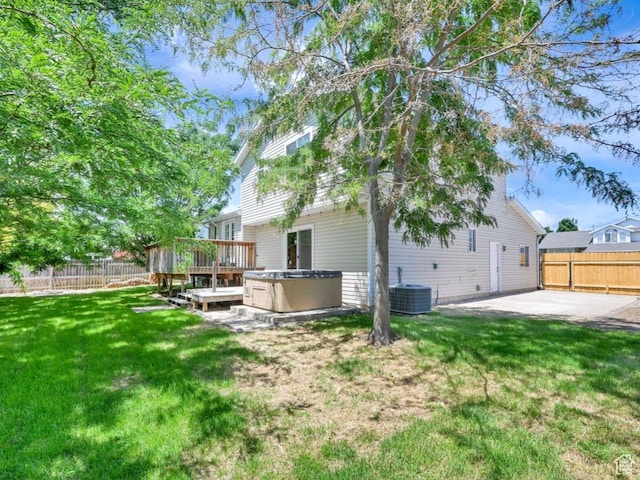 2817 W 1475 N, Layton, UT 84041 - rear view of property with a hot tub, a fenced backyard, a patio area, and a deck