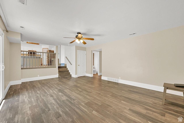 2817 W 1475 N, Layton, UT 84041 - unfurnished living room with wood finished floors, a ceiling fan, and stairs