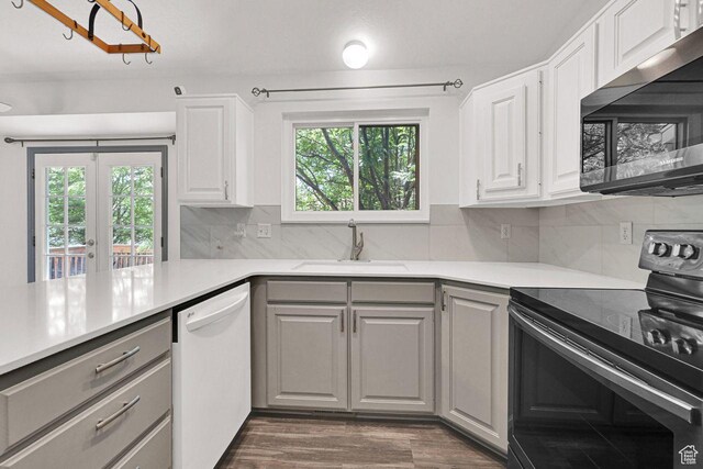 2817 W 1475 N, Layton, UT 84041 - kitchen featuring range with electric stovetop, stainless steel microwave, white dishwasher, gray cabinetry, and light countertops