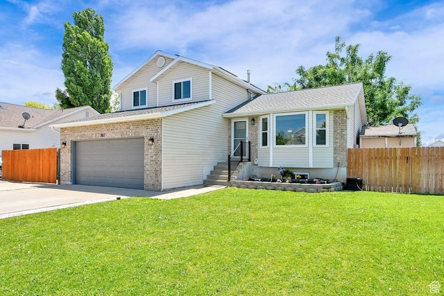 2817 W 1475 N, Layton, UT 84041 - tri-level home featuring brick siding, driveway, and a garage