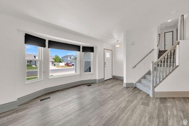 2817 W 1475 N, Layton, UT 84041 - entryway with wood finished floors, healthy amount of natural light, and stairs