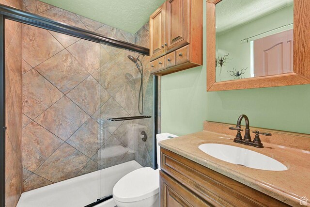 2817 W 1475 N, Layton, UT 84041 - bathroom with a textured ceiling, a stall shower, and vanity
