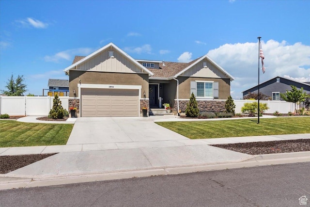 2892 W 2500 N, Clinton, UT 84015 - view of front facade with an attached garage, stone siding, stucco siding, and concrete driveway