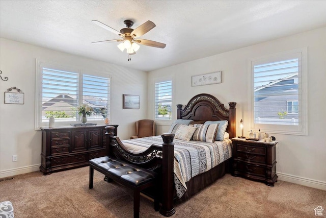 2892 W 2500 N, Clinton, UT 84015 - bedroom featuring multiple windows, light carpet, and a ceiling fan