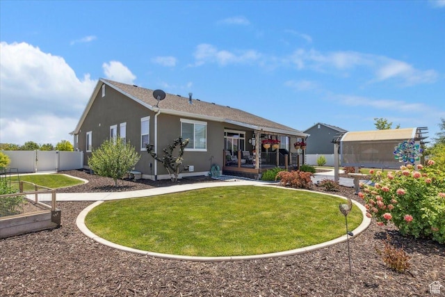 2892 W 2500 N, Clinton, UT 84015 - back of house with stucco siding and a vegetable garden