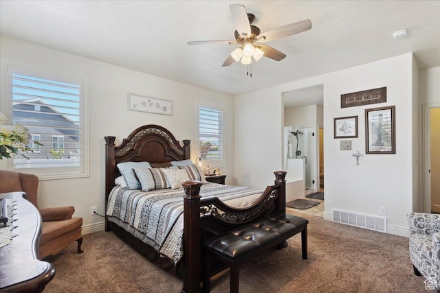 2892 W 2500 N, Clinton, UT 84015 - carpeted bedroom featuring multiple windows, ceiling fan, and ensuite bath