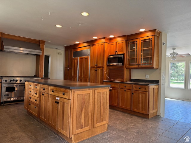 754 Quaking Aspen Ct, Park City, UT 84060 - kitchen featuring dark countertops, wall chimney exhaust hood, built in appliances, recessed lighting, and brown cabinets