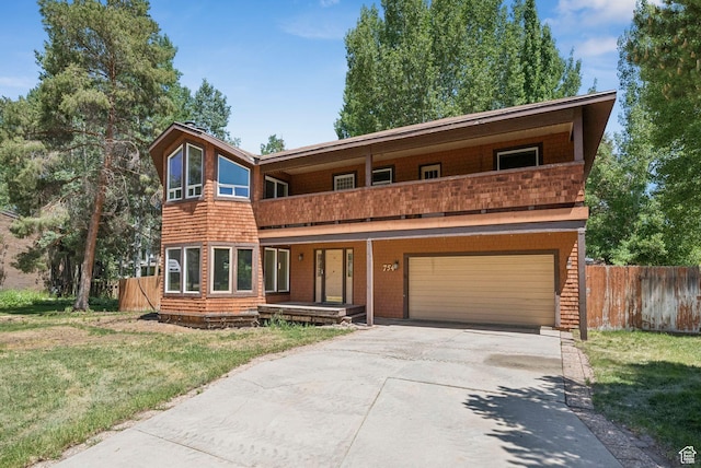 754 Quaking Aspen Ct, Park City, UT 84060 - view of front of home featuring a balcony, an attached garage, and driveway