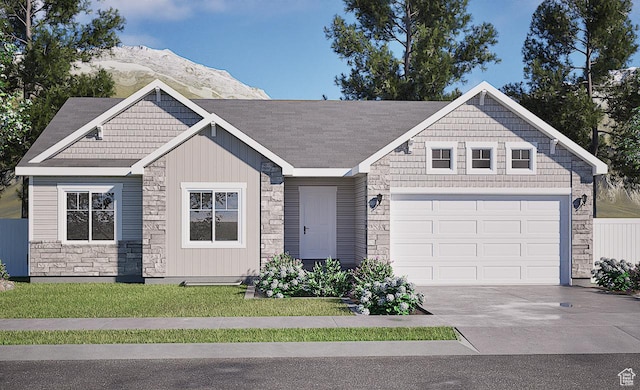 9290 N 5600 W Unit 5, Elwood, UT 84337 - craftsman inspired home featuring stone siding, concrete driveway, a garage, and a mountain view