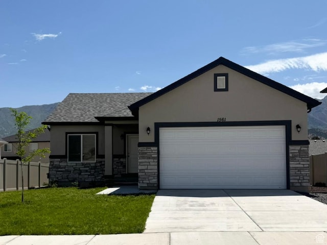 1561 S Sageberry Dr, Santaquin, UT 84655 - single story home with stone siding, stucco siding, concrete driveway, a garage, and roof with shingles