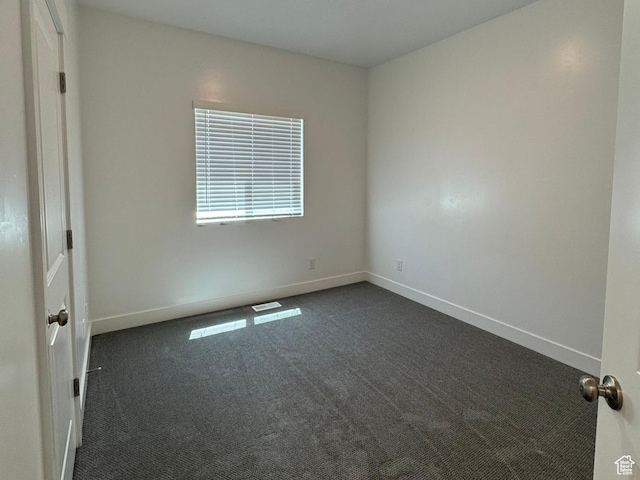 1561 S Sageberry Dr, Santaquin, UT 84655 - spare room featuring dark carpet and baseboards