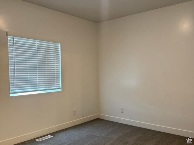 1561 S Sageberry Dr, Santaquin, UT 84655 - unfurnished room featuring baseboards and dark carpet