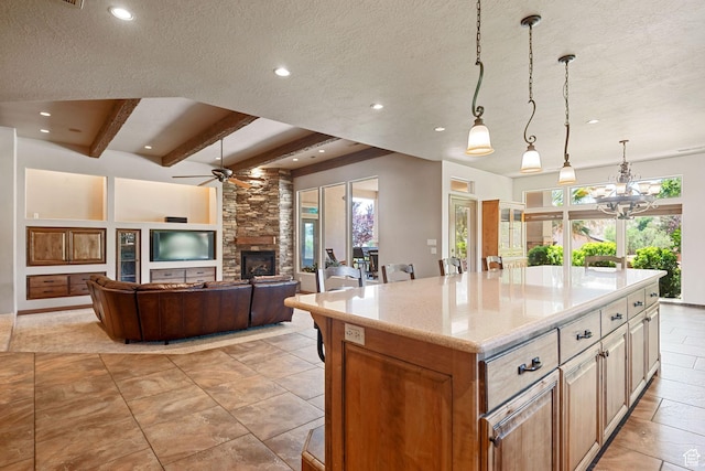 1285 Summerwood Cir, Santa Clara, UT 84765 - kitchen featuring plenty of natural light, a fireplace, recessed lighting, a ceiling fan, and beam ceiling