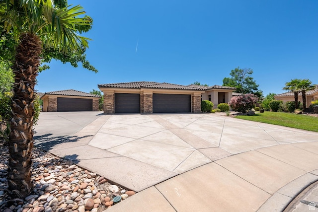 1285 Summerwood Cir, Santa Clara, UT 84765 - view of front of property with a tiled roof, concrete driveway, an attached garage, stucco siding, and stone siding