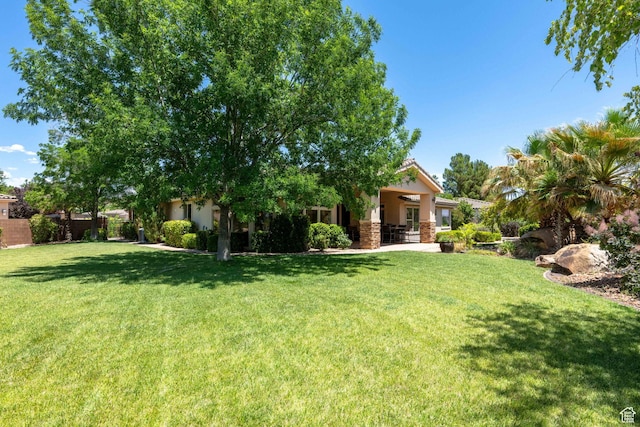 1285 Summerwood Cir, Santa Clara, UT 84765 - view of green lawn featuring ceiling fan