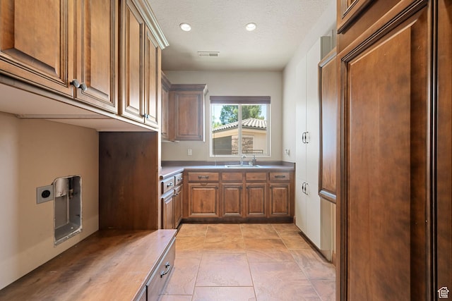 1285 Summerwood Cir, Santa Clara, UT 84765 - laundry room with cabinet space, hookup for an electric dryer, recessed lighting, a textured ceiling, and light tile patterned floors