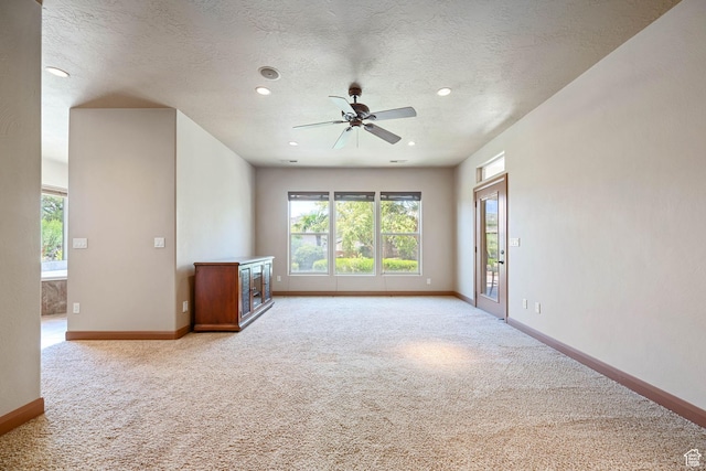 1285 Summerwood Cir, Santa Clara, UT 84765 - empty room featuring light carpet, ceiling fan, a textured ceiling, and recessed lighting