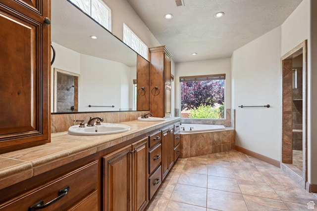 1285 Summerwood Cir, Santa Clara, UT 84765 - bathroom with a bath, double vanity, recessed lighting, tiled shower, and a textured ceiling