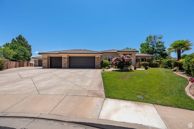 1285 Summerwood Cir, Santa Clara, UT 84765 - view of front of house featuring driveway, an attached garage, a tile roof, stucco siding, and stone siding