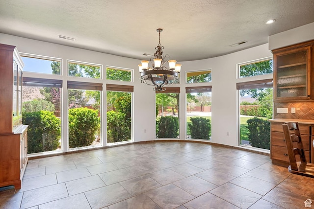 1285 Summerwood Cir, Santa Clara, UT 84765 - unfurnished dining area with a chandelier, a textured ceiling, and recessed lighting