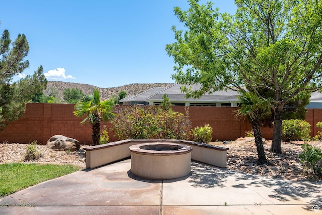 1285 Summerwood Cir, Santa Clara, UT 84765 - view of patio featuring a mountain view and a fire pit