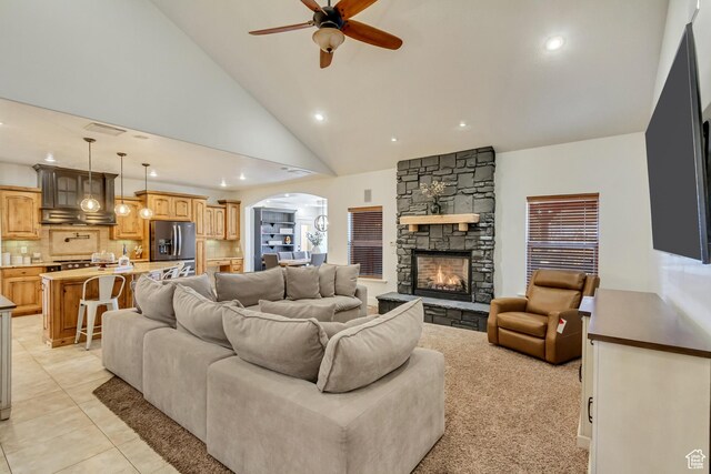 338 S Holdaway Rd, Vineyard, UT 84059 - living room featuring ceiling fan, arched walkways, recessed lighting, a fireplace, and light tile patterned floors