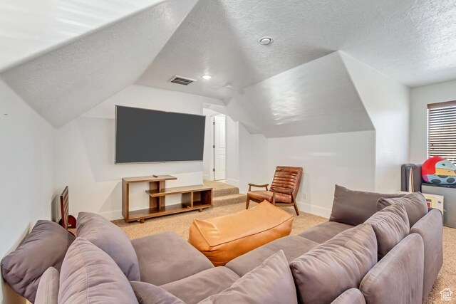 338 S Holdaway Rd, Vineyard, UT 84059 - carpeted cinema room featuring a textured ceiling and vaulted ceiling