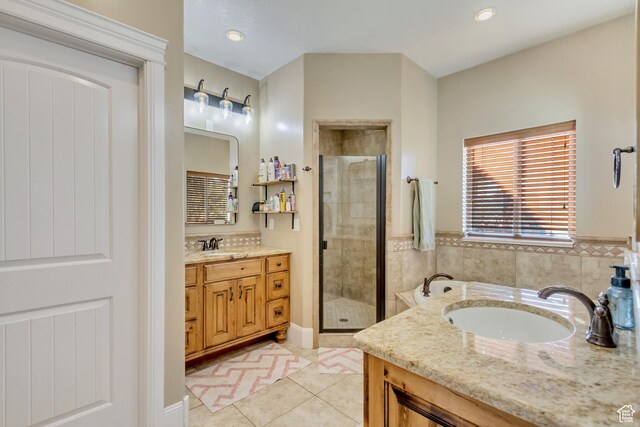338 S Holdaway Rd, Vineyard, UT 84059 - bathroom with vanity, a stall shower, tile patterned floors, and a garden tub