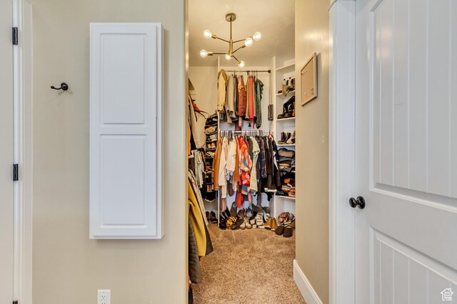 338 S Holdaway Rd, Vineyard, UT 84059 - walk in closet featuring carpet and a chandelier
