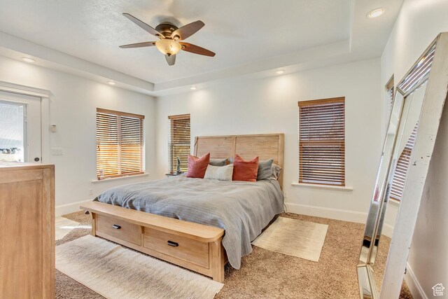 338 S Holdaway Rd, Vineyard, UT 84059 - carpeted bedroom with a raised ceiling, multiple windows, recessed lighting, and ceiling fan